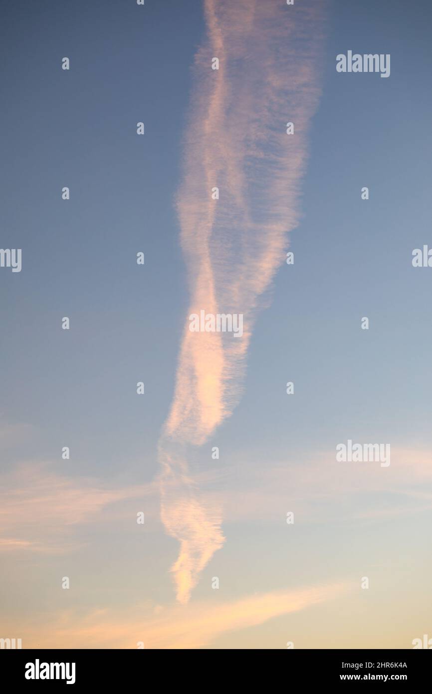 Traces of planes in the sky, exhaust fumes in nice lines on a blue