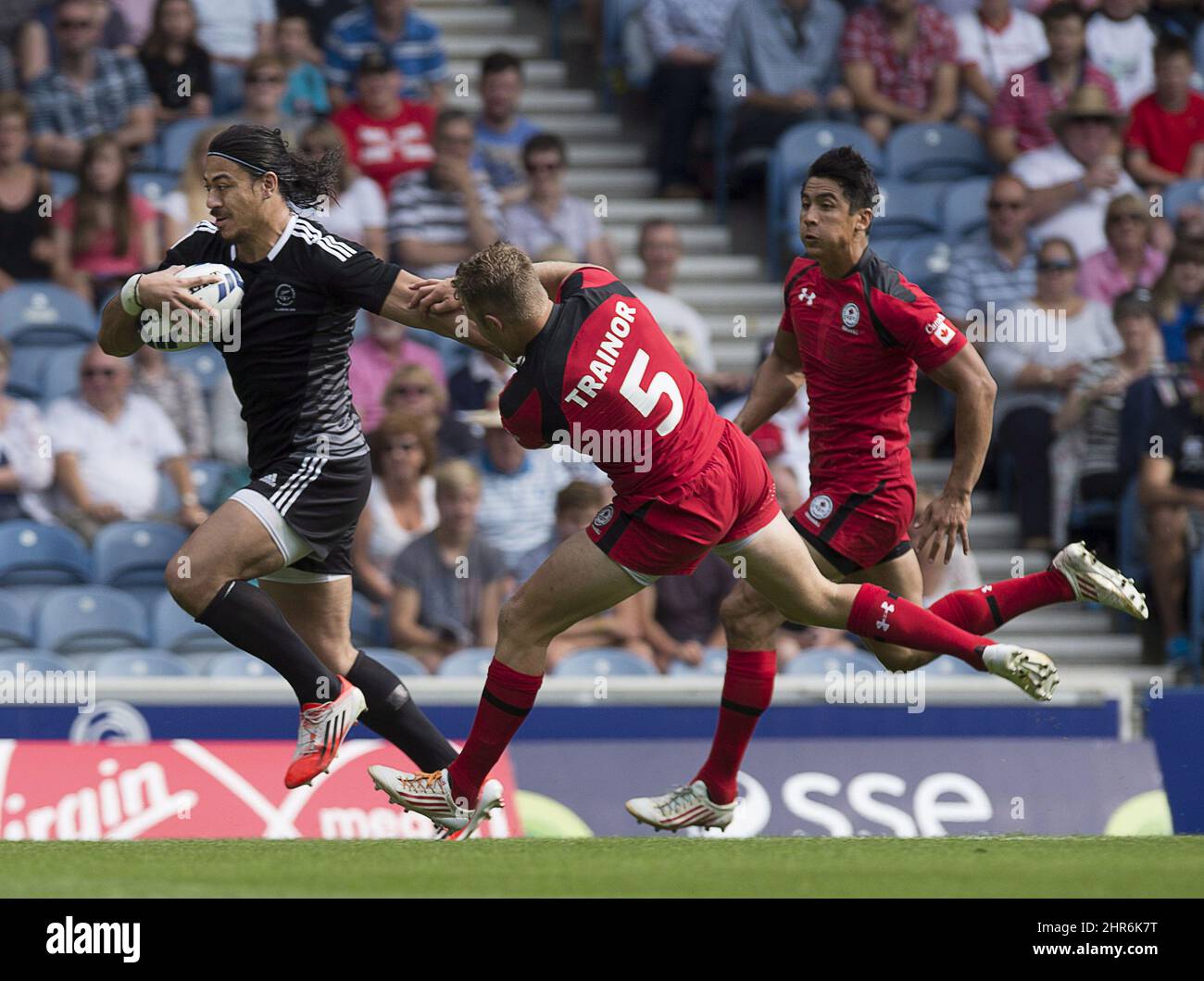Canada's Conor Trainor grabs New Zealand's Ben Lam in Commonwealth ...
