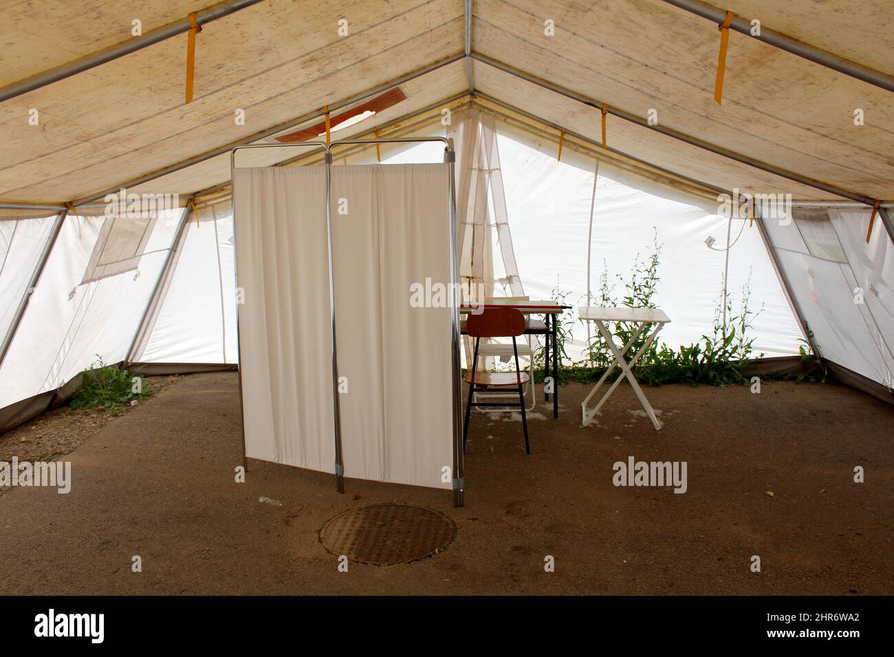 Inside of abandoned white field hospital tent built by military on