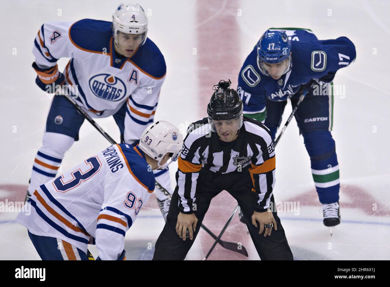 Referee Ghislain Hebert wears a camera on his helmet during the first