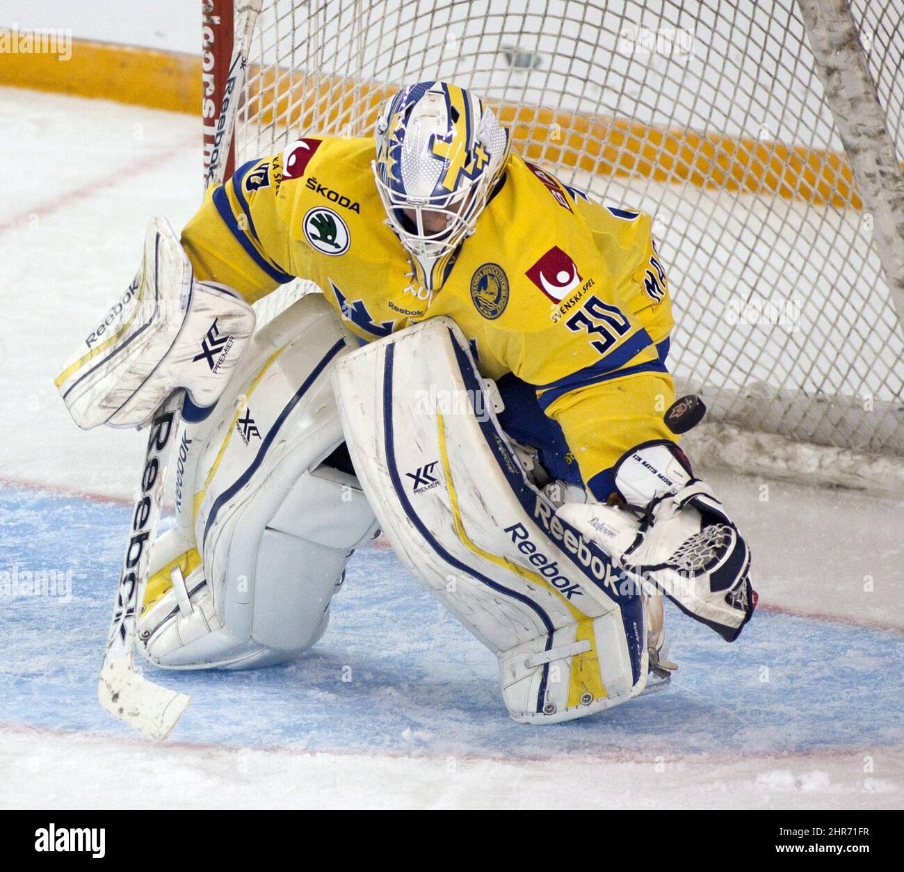 Team Sweden goaltender Kim Martin Hasson makes a save against Team Caanda during the third period at the Four Nations Cup women's hockey tournament in Kamloops, B.C. on November 4, 2014. Hassan made 42 saves as Canada defeated Team Sweden 2-0. THE CANADIAN PRESS/Jeff Bassett Stock Photo