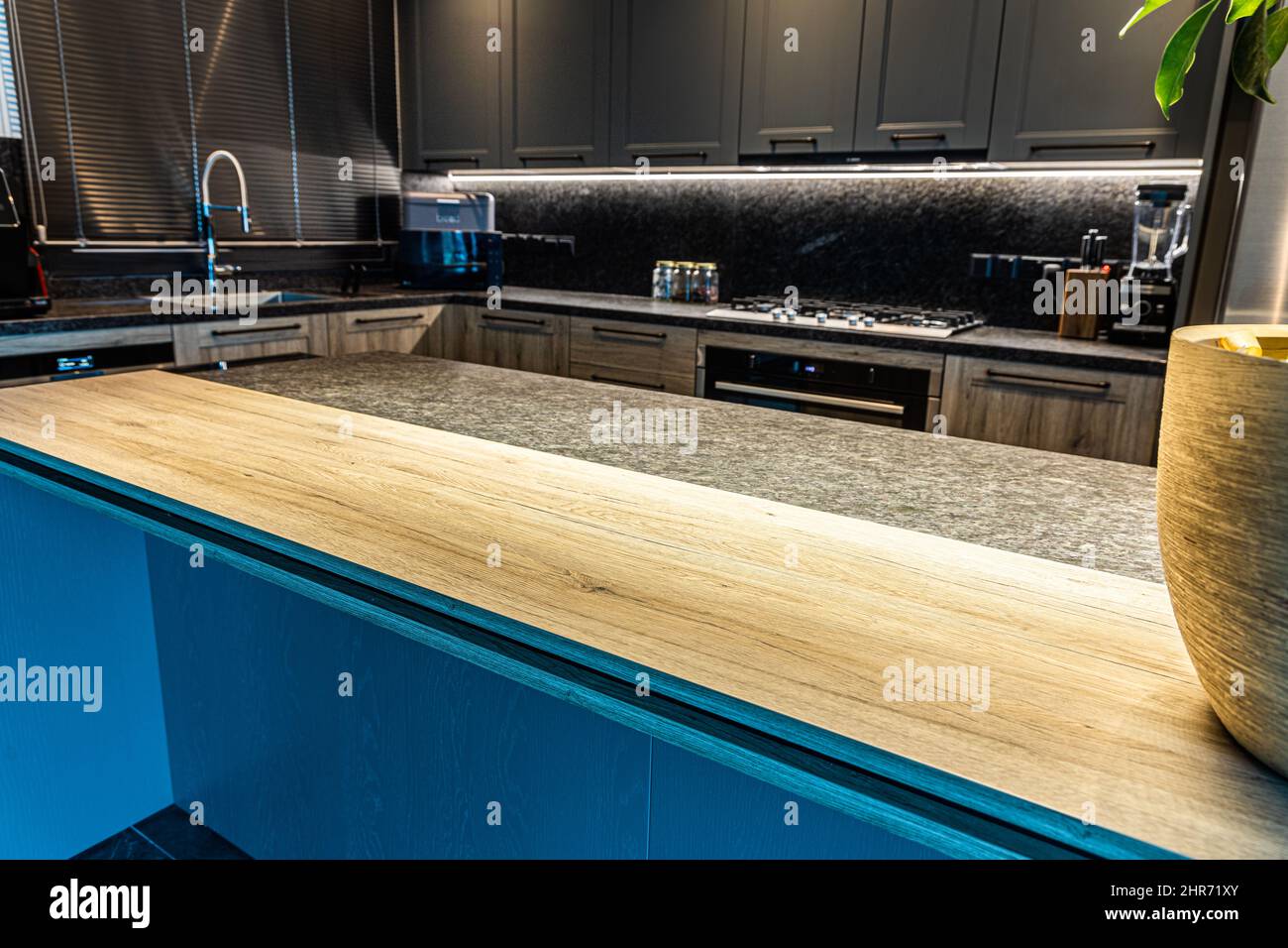 Beautiful kitchen interior with a wooden cupboard Stock Photo - Alamy