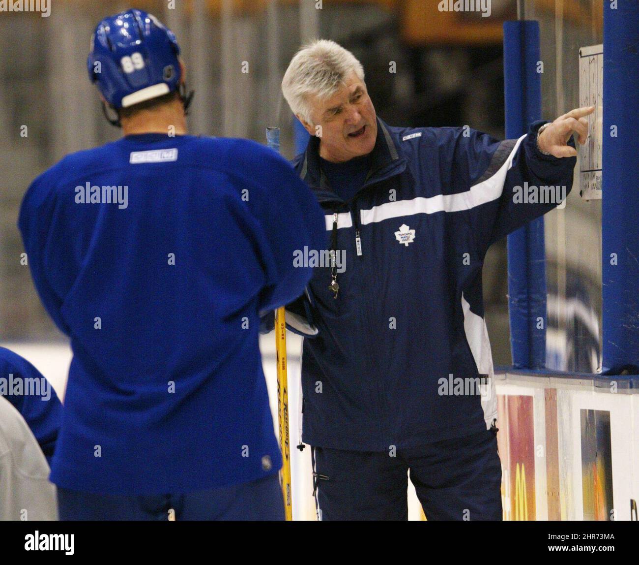 Toronto Maple Leafs head coach Pat Quinn gives instructions to players