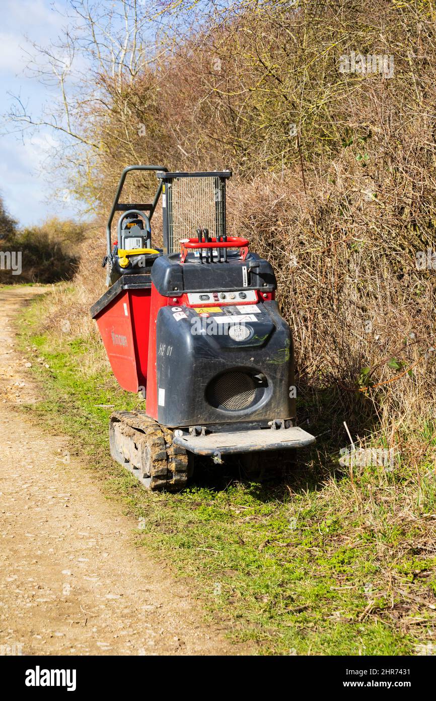 Hinowa HS01 tracked mini dump truck of the Grantham Canal Trust on the towpath, Woolsthorpe by Belvoir, Lincolnshire. Stock Photo