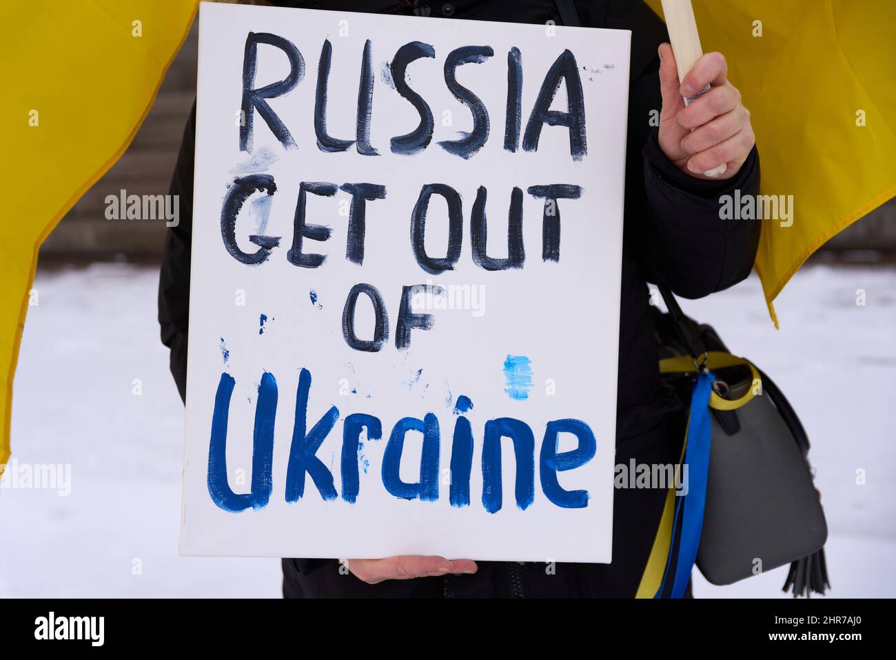 Helsinki, Finland - February 22, 2022: Demonstrator sign demanding Russia Get Out of Ukraine in a rally against Russia’s military actions and occupati Stock Photo