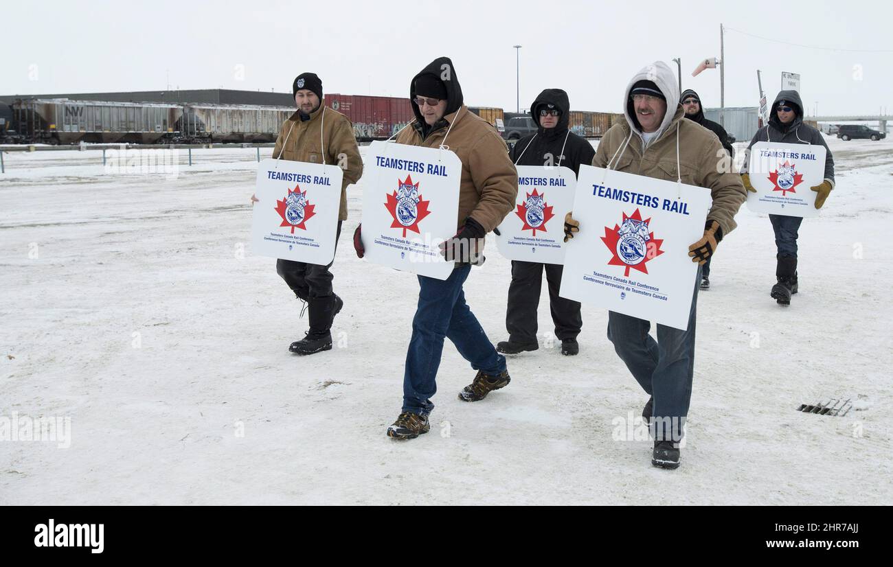 Striking Canadian Pacific Railway employees walk the picket line