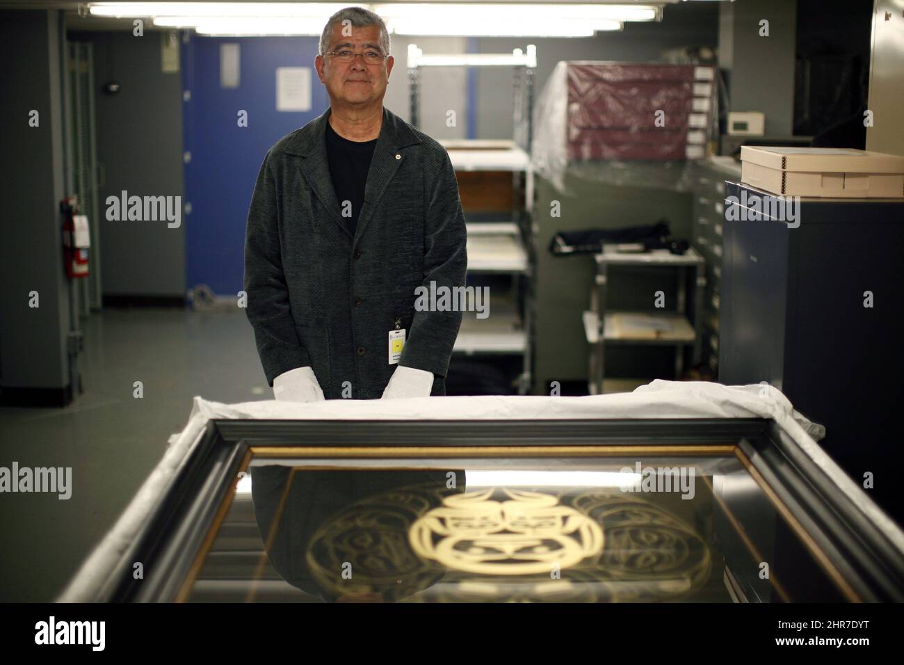 Arthur Vickers poses with a piece of his artwork at the Royal BC Museum ...