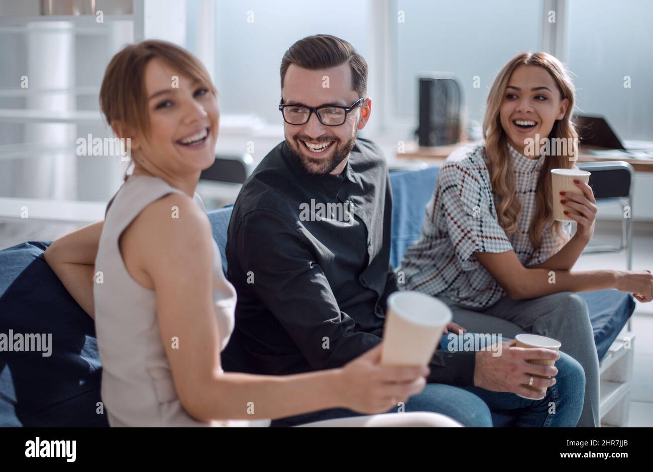 business team sitting in the office lobby at work break Stock Photo - Alamy