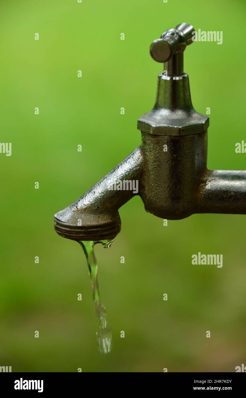 Outdoor faucet with water flowing Stock Photo Alamy