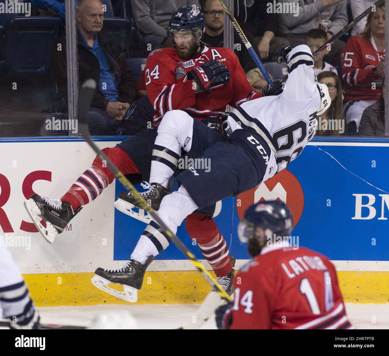 Rimouski Oceanics' Guillaume McSween falls back when colliding with Oshawa Generals' Hunter Smith during second period action Saturday, May 23, 2015 at the Memorial Cup tournament in Quebec City. THE CANADIAN PRESS/Jacques Boissinot Stock Photo