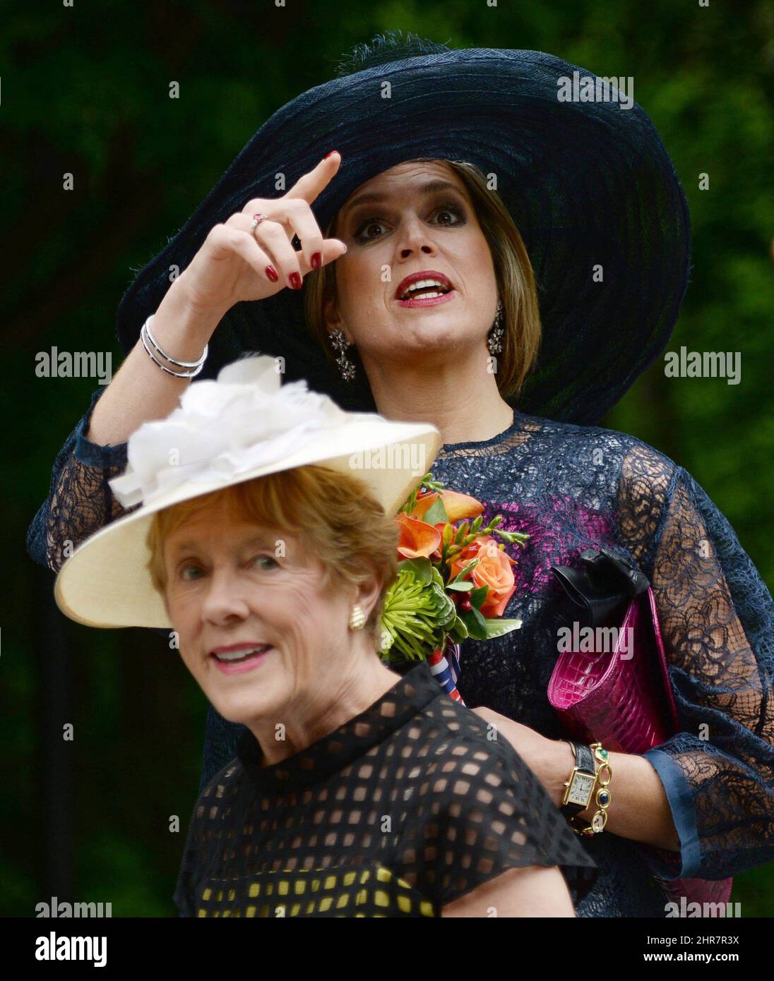 Queen Maxima of the Netheralnds (top) points with Sharon Johnston, wife ...