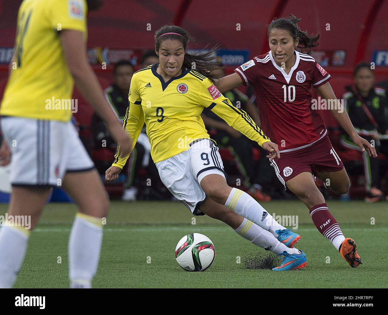 Mexico's Stephany Mayor, right, and Colombia's Orianica Velasquez fight for the ball during FIFA Women's World Cup second half soccer action in Moncton, N.B. on Tuesday, June 9, 2015. THE CANADIAN PRESS/Andrew Vaughan Stock Photo