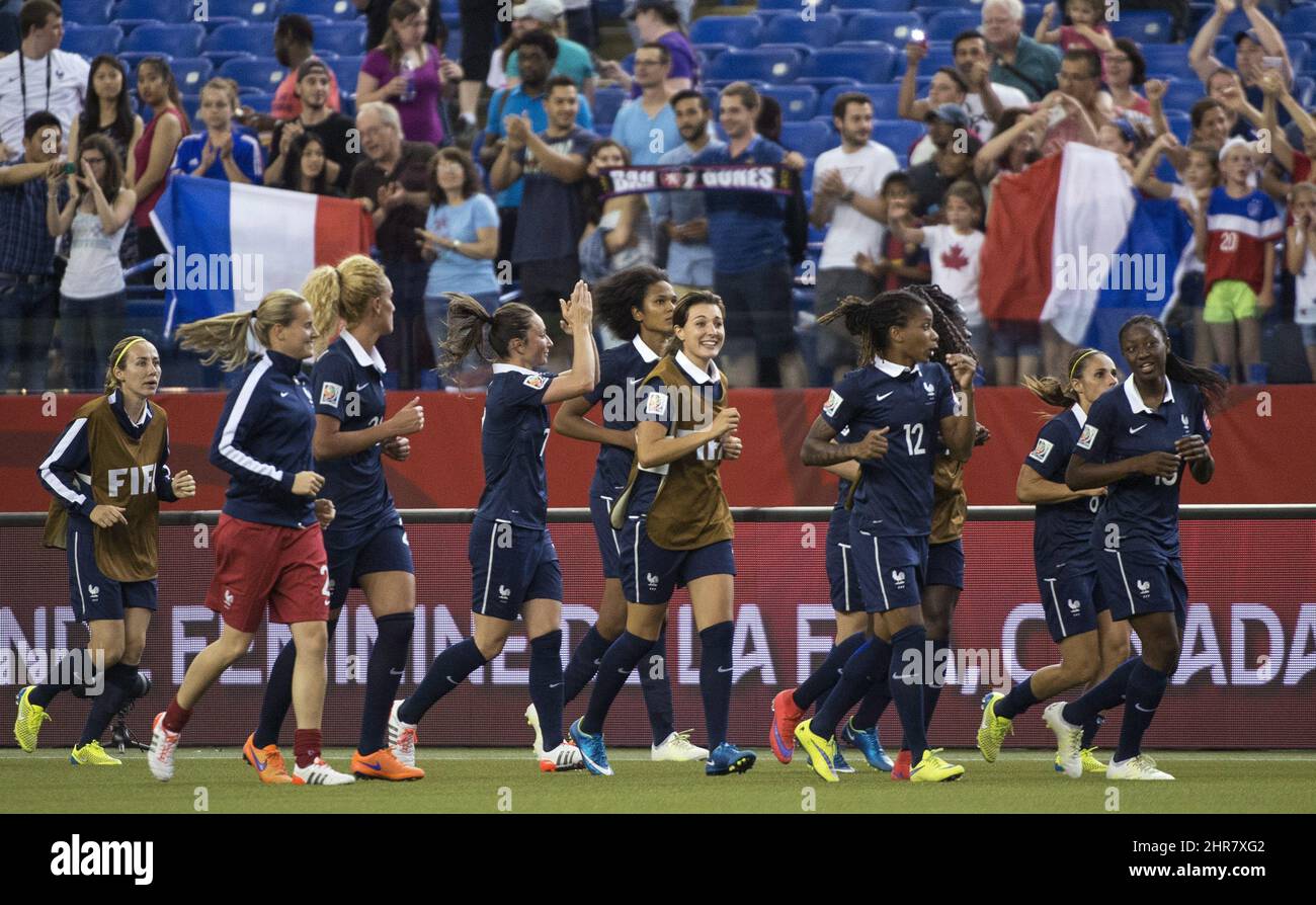 Members of team France celebrate their 30 victory over South Korea before their fans during the