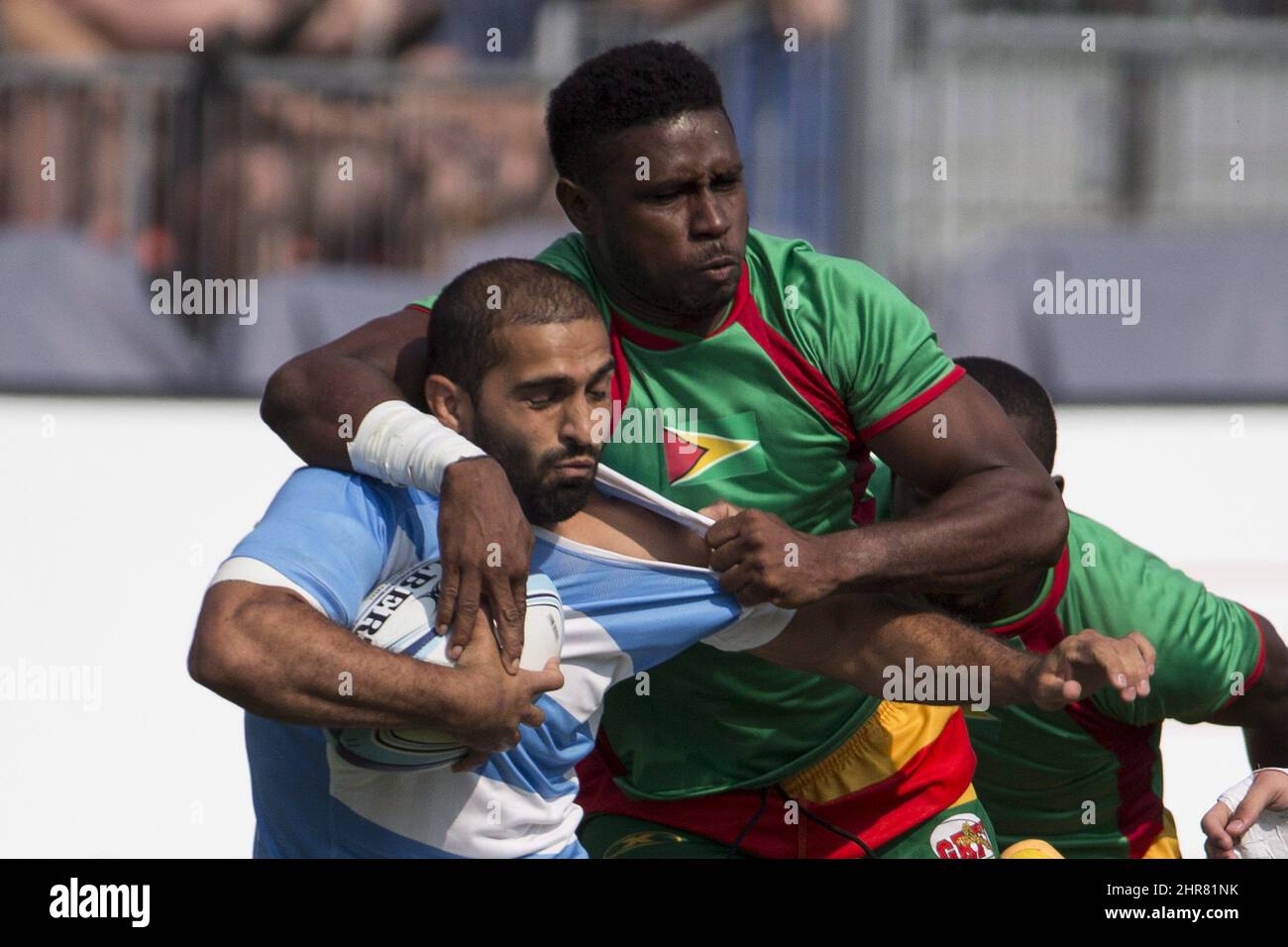 Argentina's Gaston Revol (left) is tackled by Guyana's Claudius Butts during men's rugby sevens at the Pan Am games in Toronto on Saturday July 11. 2015. THE CANADIAN PRESS/Chris Young Stock Photo