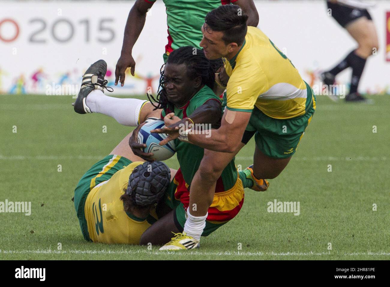 Guyana's Ronald Mayers (centre) is tackled by Brazil's Juliano Ernani Malengreau Fiori (left) and Lucas Domingues during men's rugby sevens at the Pan Am games in Toronto on Saturday July 11. 2015. THE CANADIAN PRESS/Chris Young Stock Photo