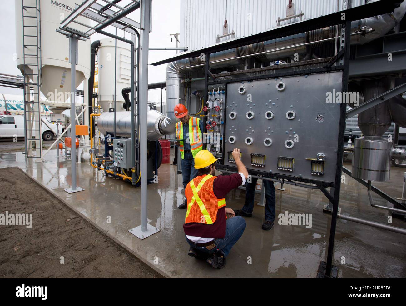 Workers calibrate equipment at Calgarybased Carbon Engineering's first