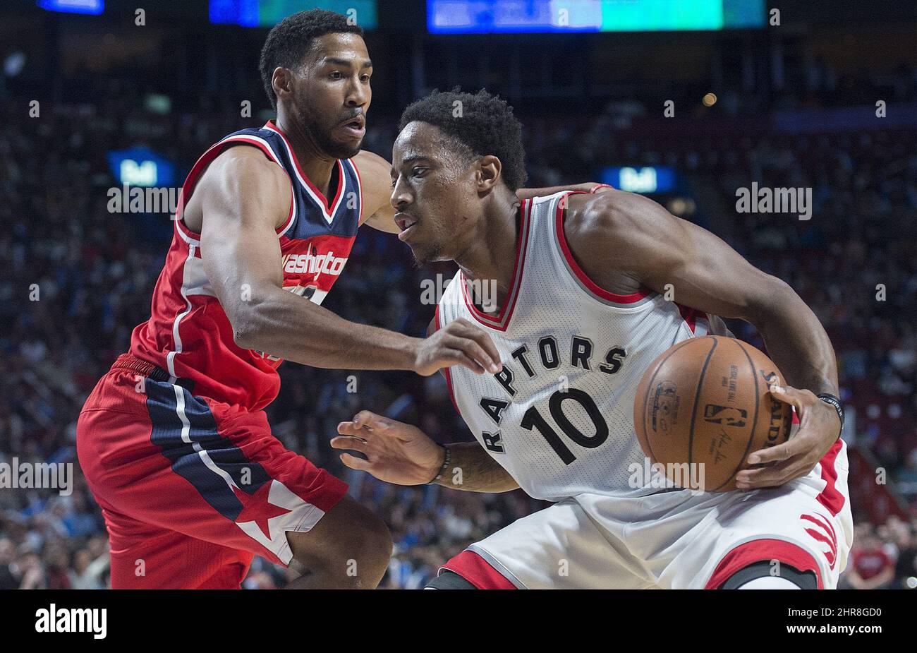 Toronto Raptors' DeMar DeRozan (10) drives to the net as Washington Wizards' Gary Neal defends during second quarter NBA pre-season basketball action in Montreal, Friday, October 23, 2015. THE CANADIAN PRESS/Graham Hughes Stock Photo