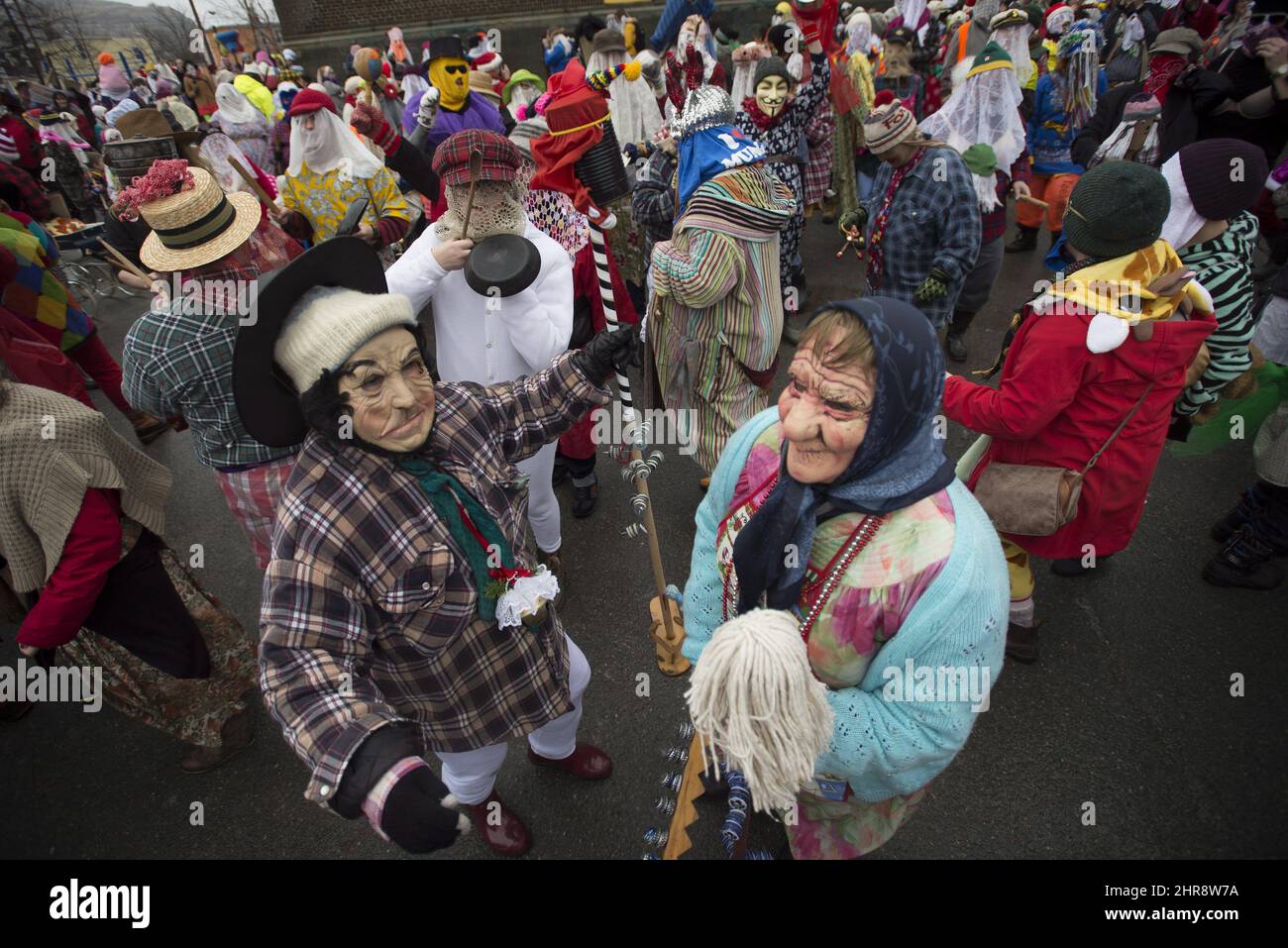 People gather dressed in costume during the annual Mummers Parade in