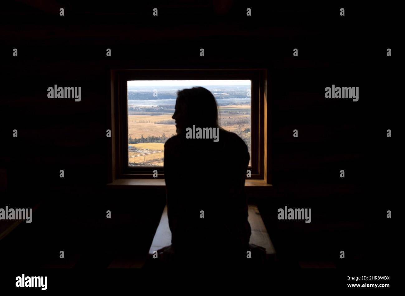 A hiker takes in the view from the Western Shelter in Gatineau Park, as temperatures in Ottawa reached a high of 17 degrees celsius on Christmas Eve, Thursday, Dec. 24, 2015. THE CANADIAN PRESS/Justin Tang Stock Photo
