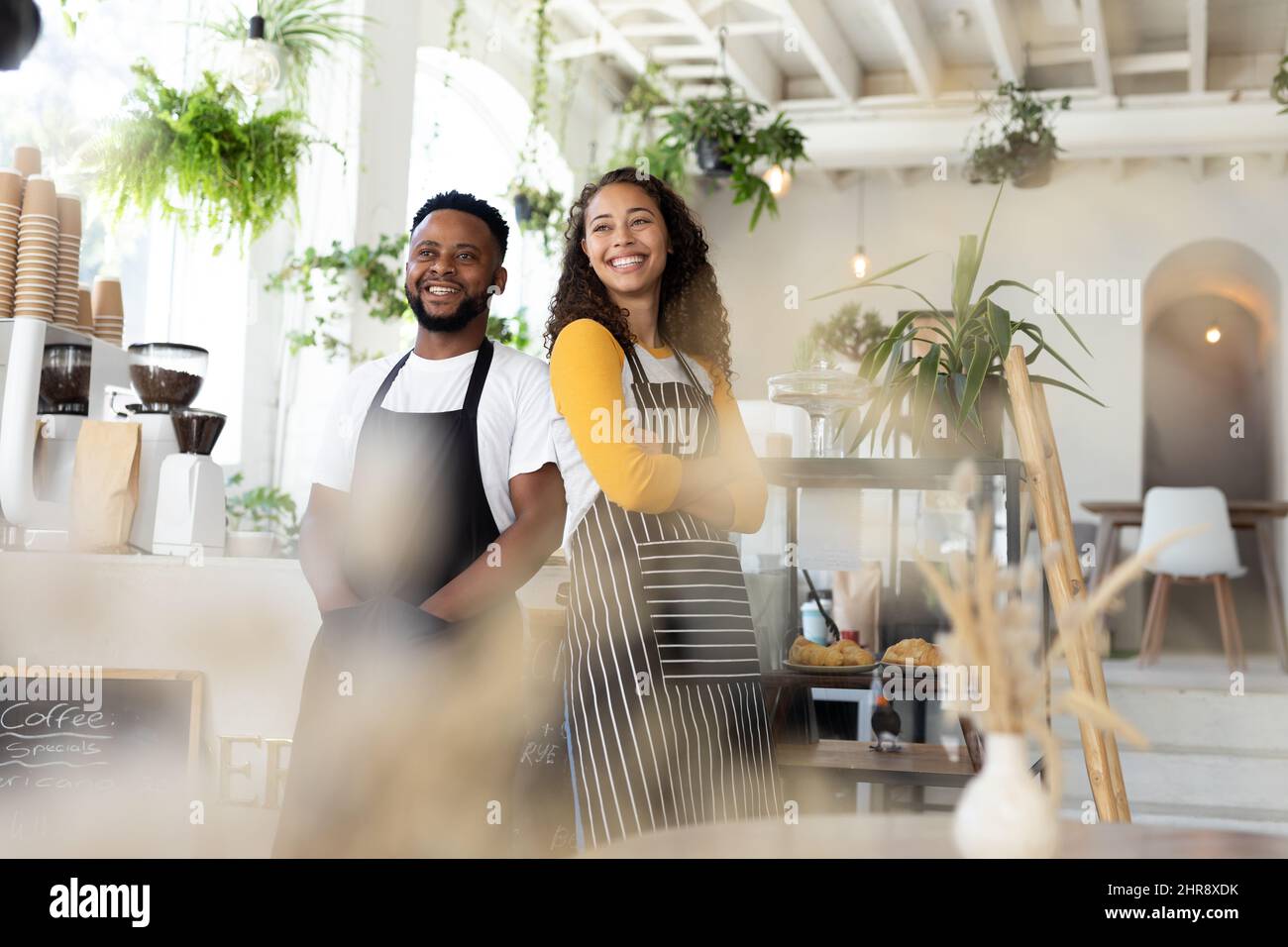 Female baristas in aprons hi-res stock photography and images - Alamy