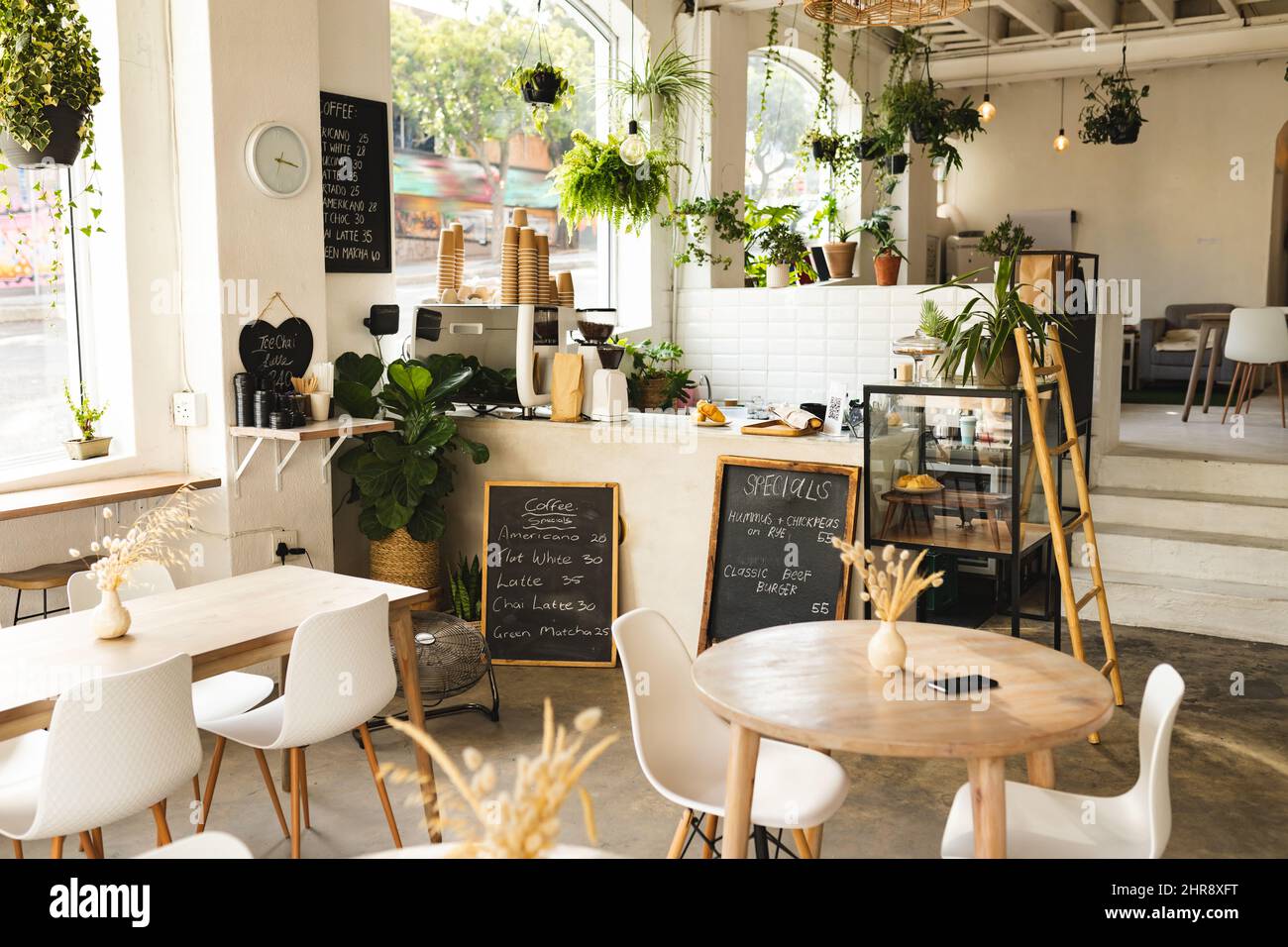 Interior of modern coffee shop with tables and chairs Stock Photo Alamy
