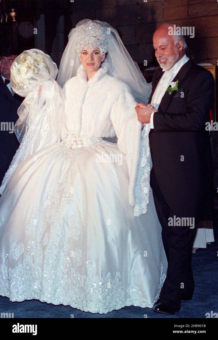Quebec pop star Celine Dion leaves the church with her husband Rene Angelil  after their wedding ceremony in Montreal, Saturday, Dec. 17, 1994. Angelil,  the entertainment maestro who guided Dion to superstardom, image size:891x1390