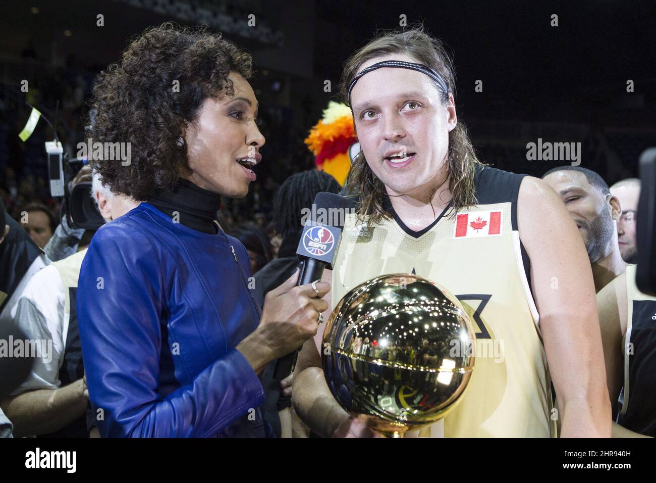 Team Canada's Win Butler of Arcade Fire (right) holds the MVP trophy as