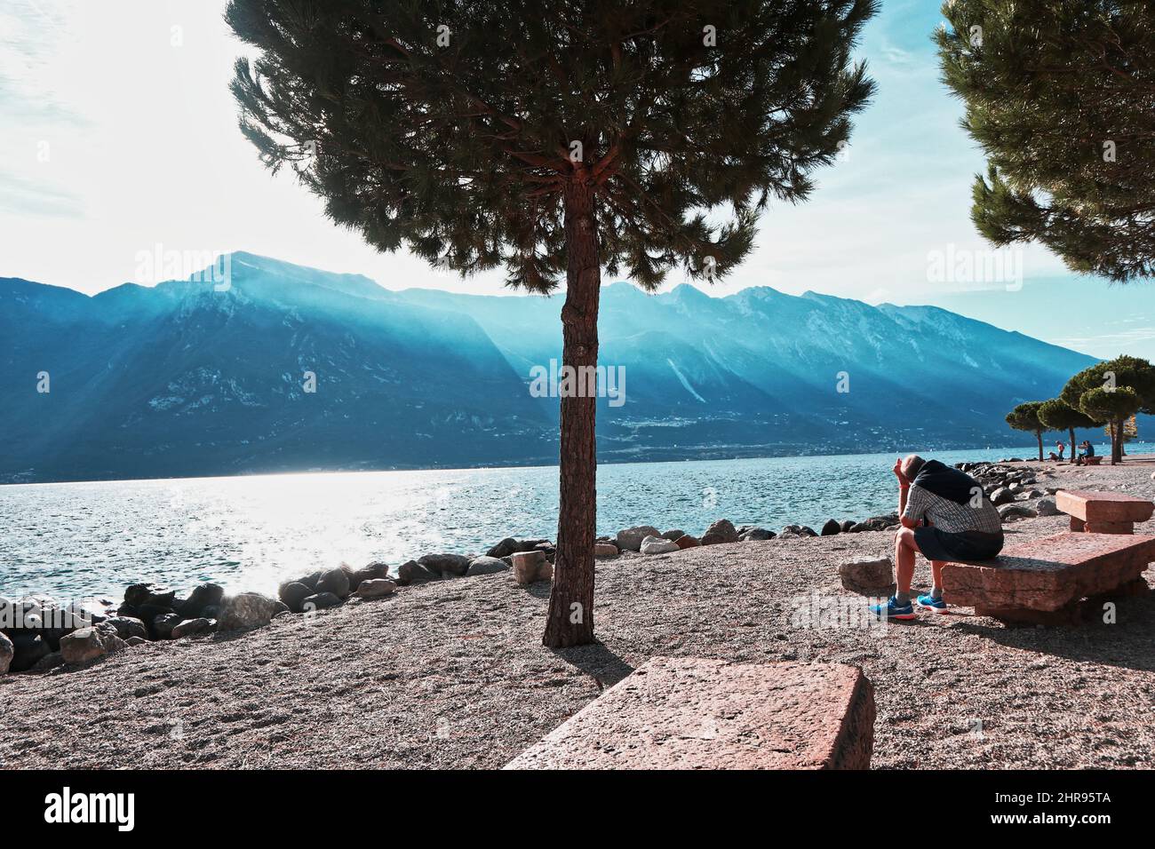 Bench man lake garda italy hi-res stock photography and images - Alamy