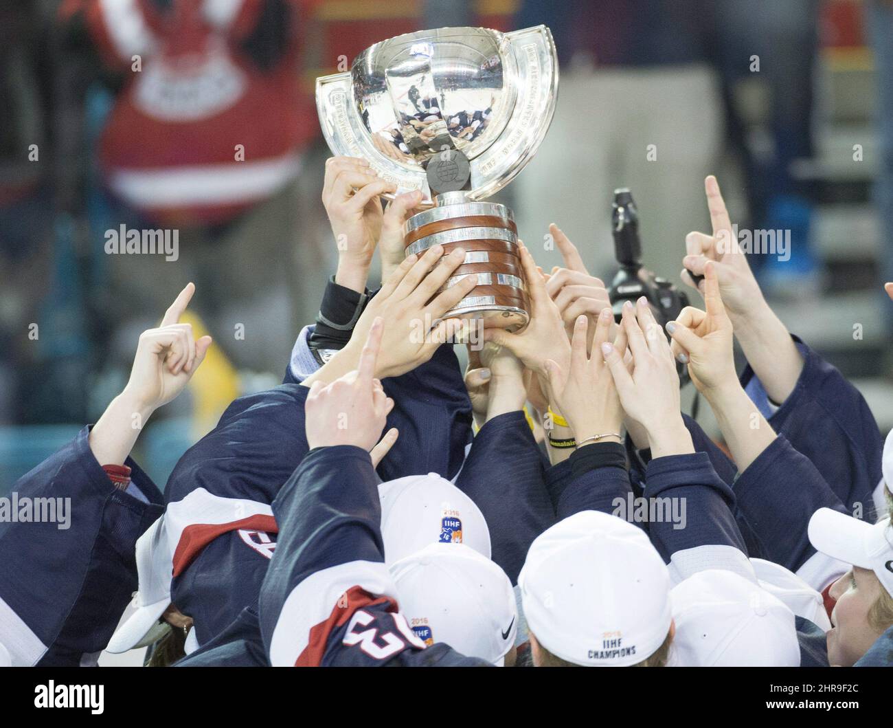Team USA holds up the championship trophy after defeating Canada 10 in