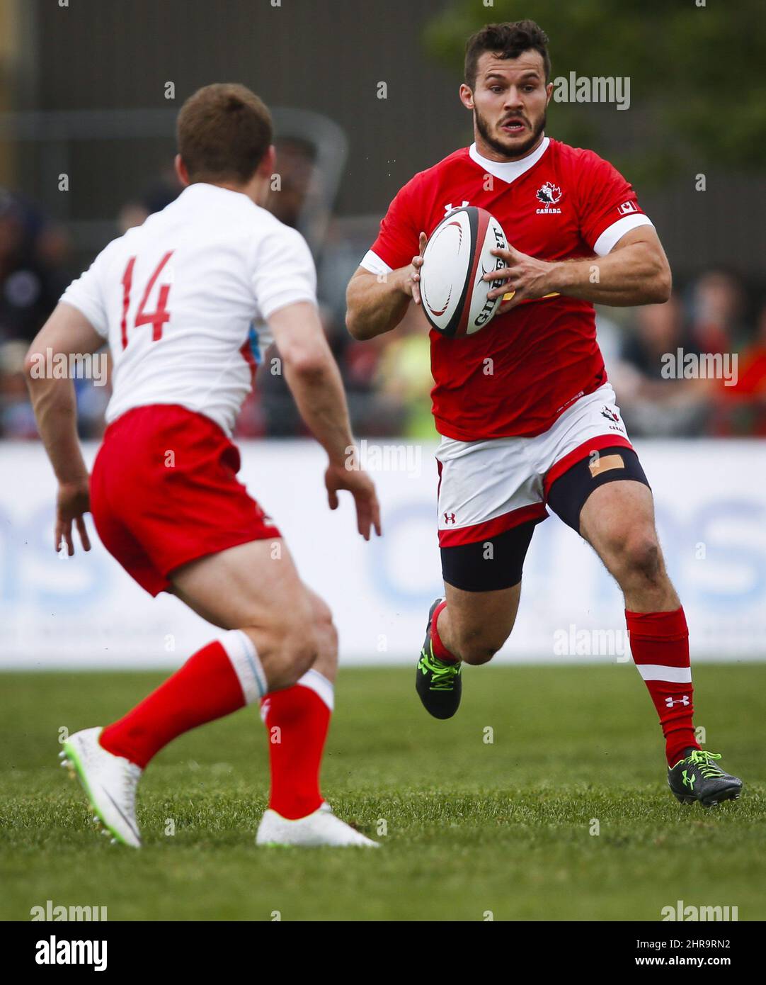 Russia's Uzunov Konstantin prepares to tackle Canada's Taylor Paris
