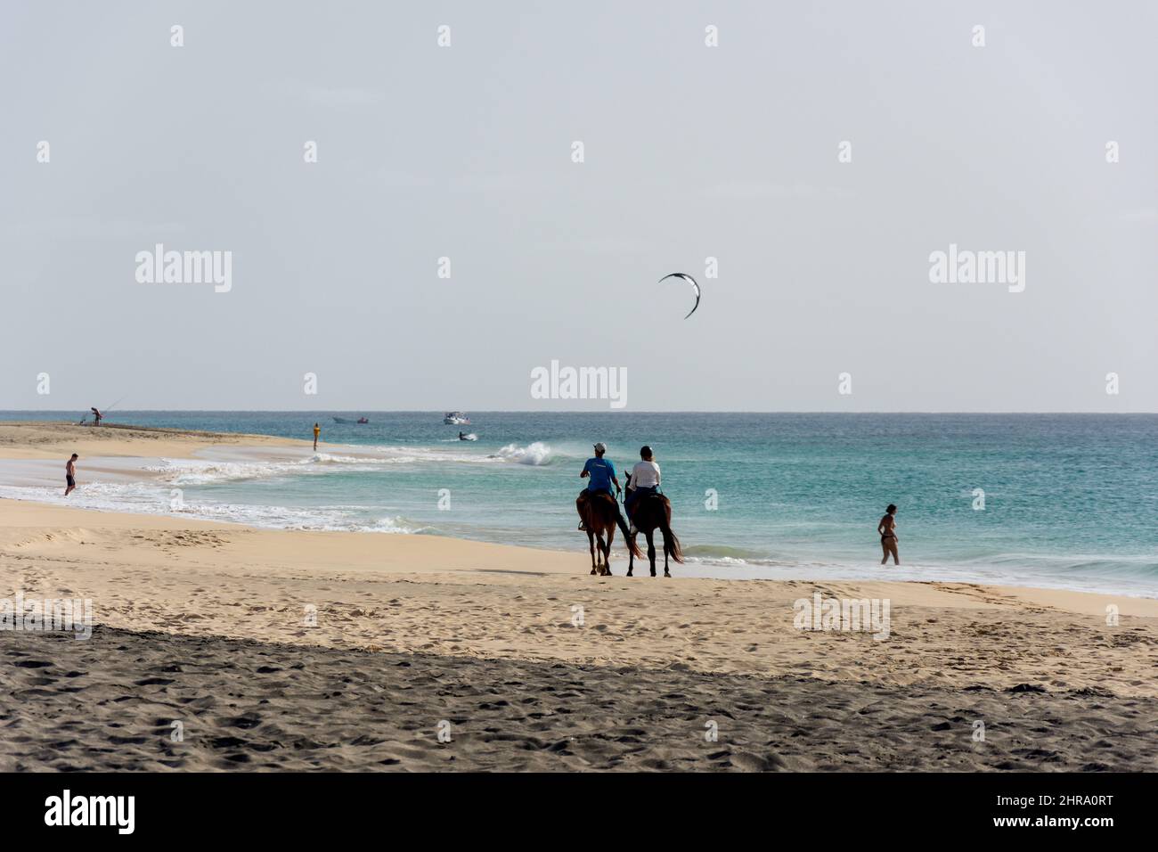 Horse riding and kite surfing, Dune of Sal Beach, Santa Maria, Sal (IIha do Sal), República de Cabo (Cape Verde) Stock Photo