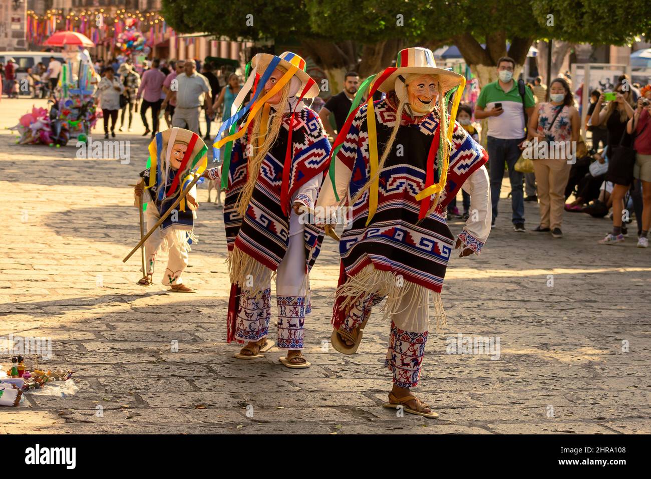 Beautiful shot of men wearing traditional costumes and dancing during a