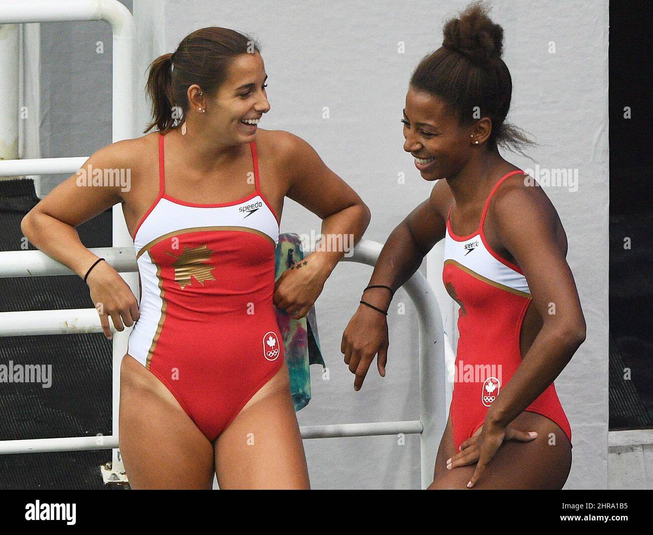https://c8.alamy.com/comp/2HRA1B5/pamela-ware-left-and-jennifer-abel-of-canada-share-a-laugh-before-they-compete-in-the-womens-synchronized-three-metre-springboard-diving-final-at-the-2016-olympic-games-in-rio-de-janeiro-brazil-on-sunday-aug-7-2016-the-canadian-presssean-kilpatrick-2HRA1B5.jpg