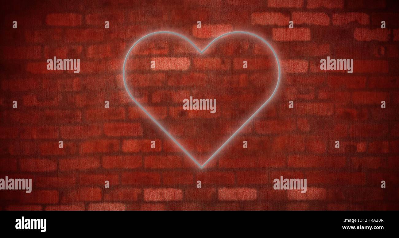 Image of glowing neon heart icon on brick wall Stock Photo - Alamy