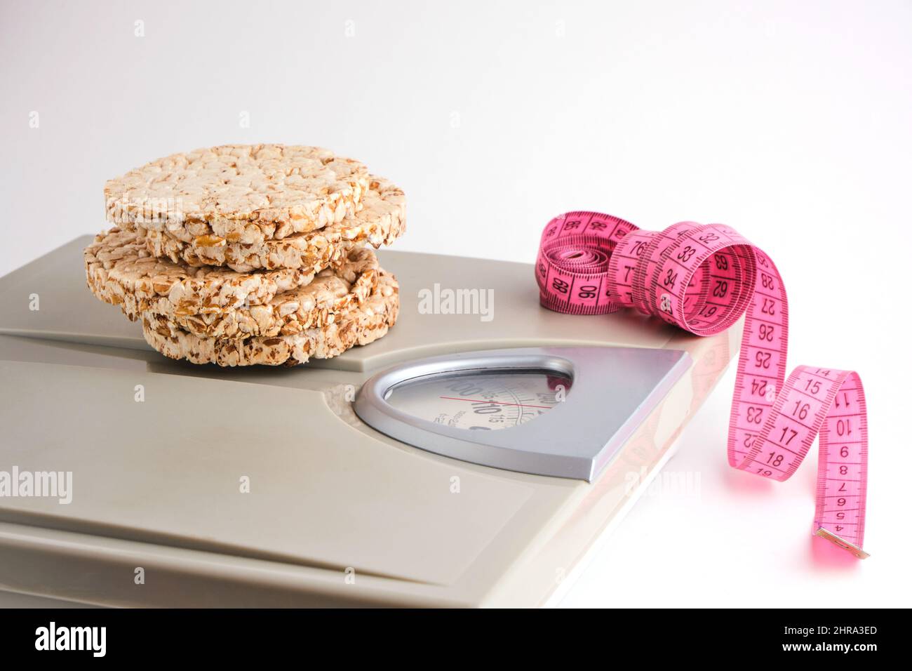 Wheat Loaves Floor Scales And Measuring Tape On A White Background Wheat loaves floor scales and measuring tape on a white background