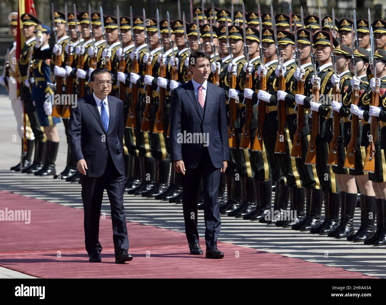 Canadian Prime Minister Justin Trudeau observes troops of the People's ...