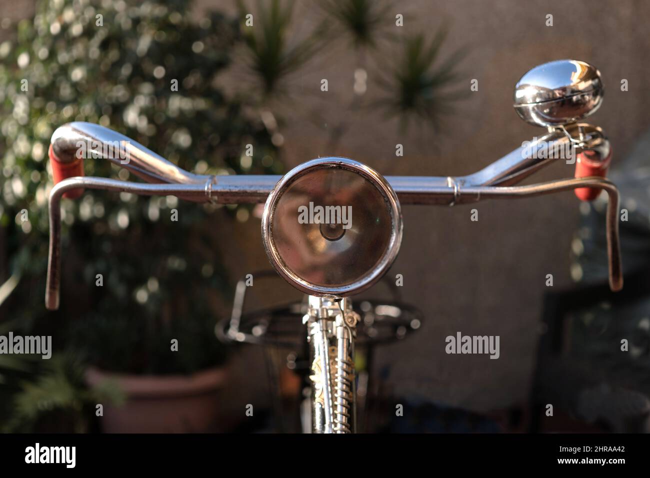Vintage bike handlebar with an antique light beacon bell brakes Stock Photo Alamy