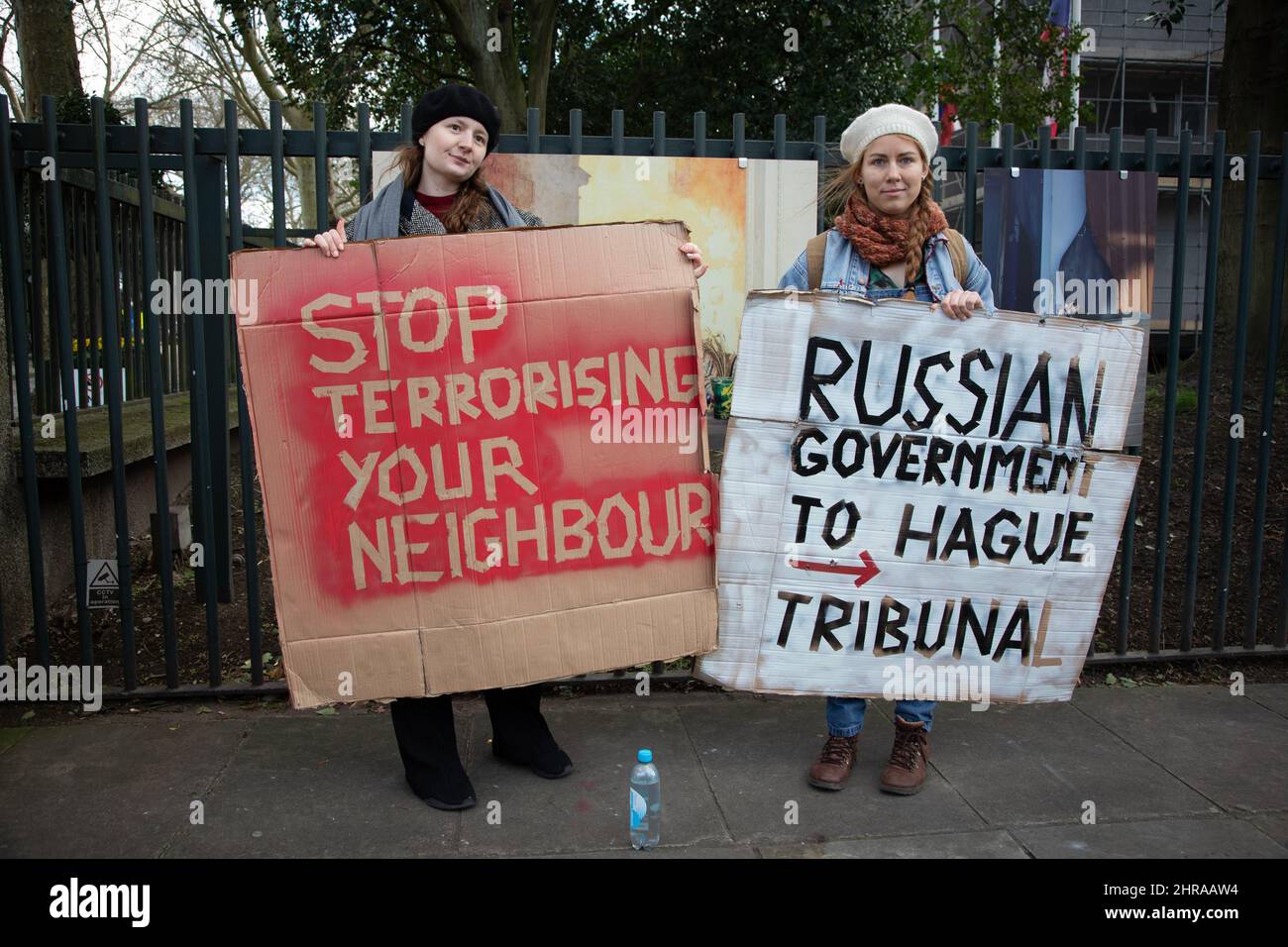 London, UK. 25th Feb, 2022. Claudia from Poland and Elena from Lithuania hold up protest signs outside the Russian Embassy, protesting against Russia's recent attack on the Ukraine Credit: Kiki Streitberger/Alamy Live News Credit: Kiki Streitberger/Alamy Live News Stock Photo