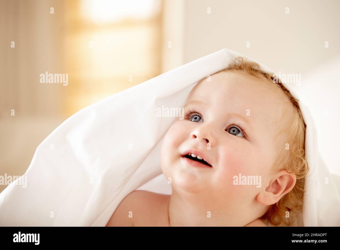 Filled with wonder - Childhood curiousity. Fascinated baby boy looking up at something. Stock Photo