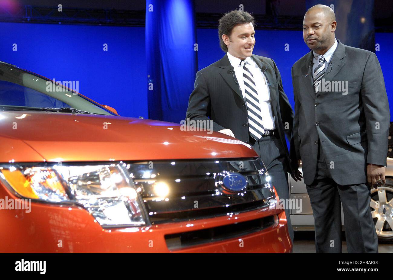 Ford's president of the Americas, Mark Fields, left, and Bill Osborne, president and CEO, Ford Motor Company of Canada look at the Ford Edge in Toronto Wednesday, Feb. 15, 2006. Ford announced that it's Oakville, Ont., assembly plant will assemble hybrid versions of the new Ford Edge and Lincoln MKX crossover utility vehicles later this decade. (AP Photo/Canadian Press, Aaron Harris) Stock Photo