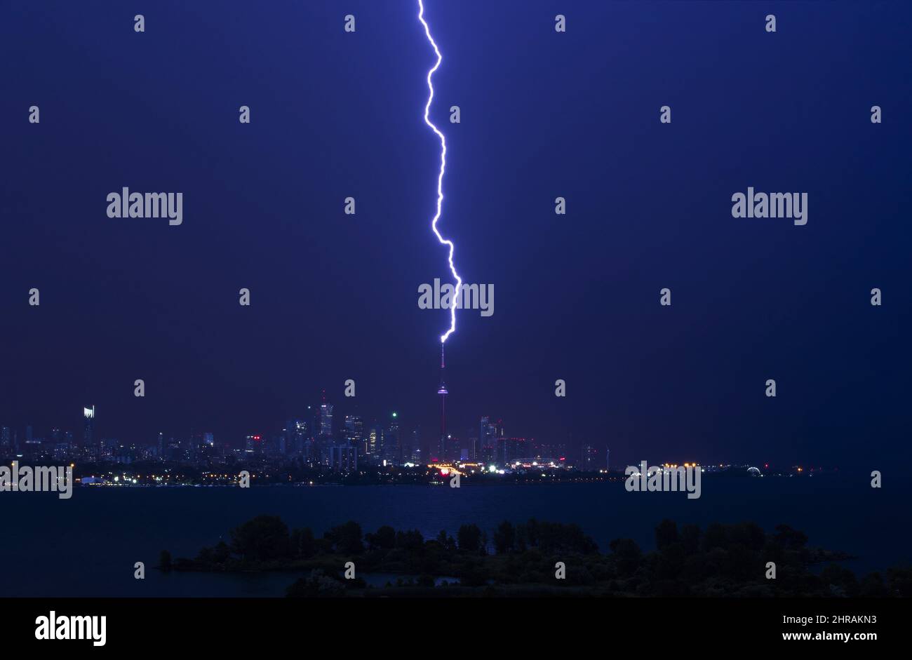 A lightning bolt strikes the CN Tower during an electrical storm in
