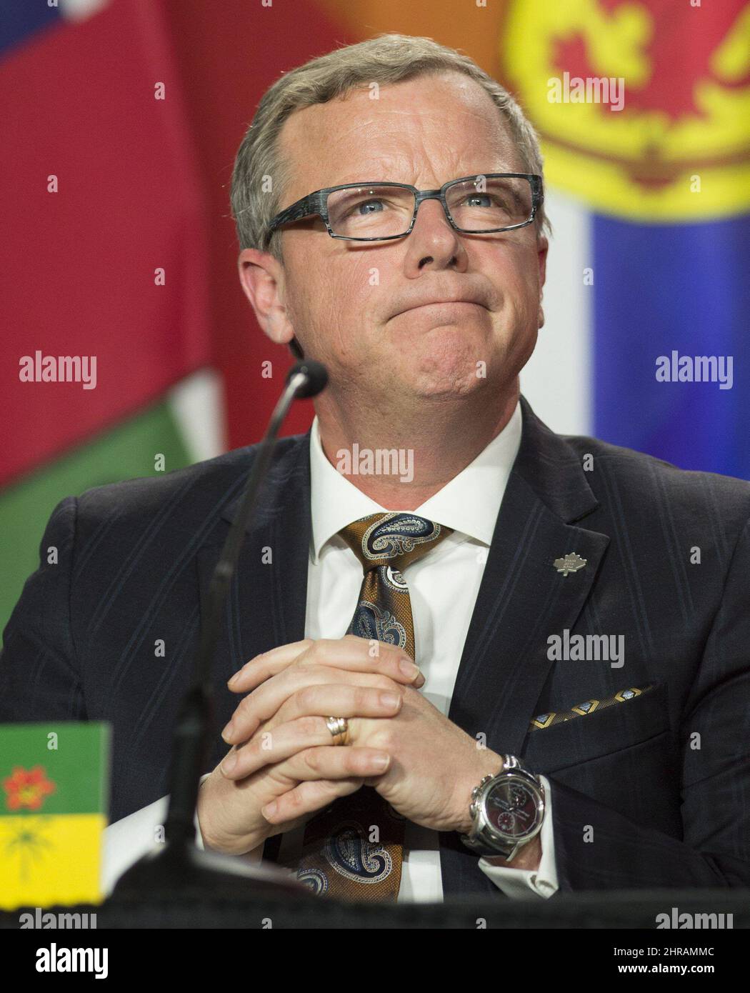 Saskatchewan Premier Brad Wall listens to a speaker during the closing
