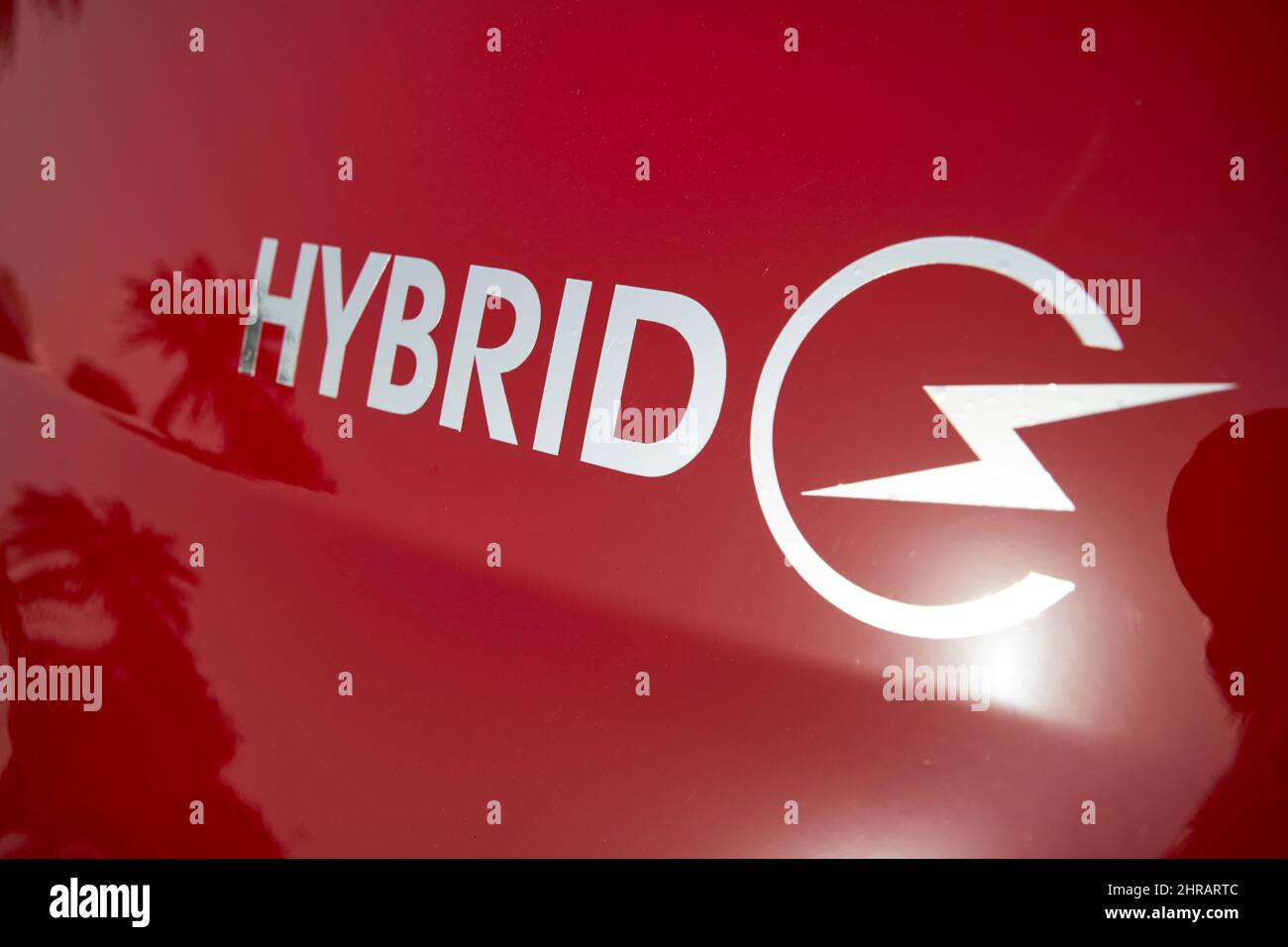 hybrid symbol on a red hire car Lanzarote, Canary Islands, Spain Stock Photo
