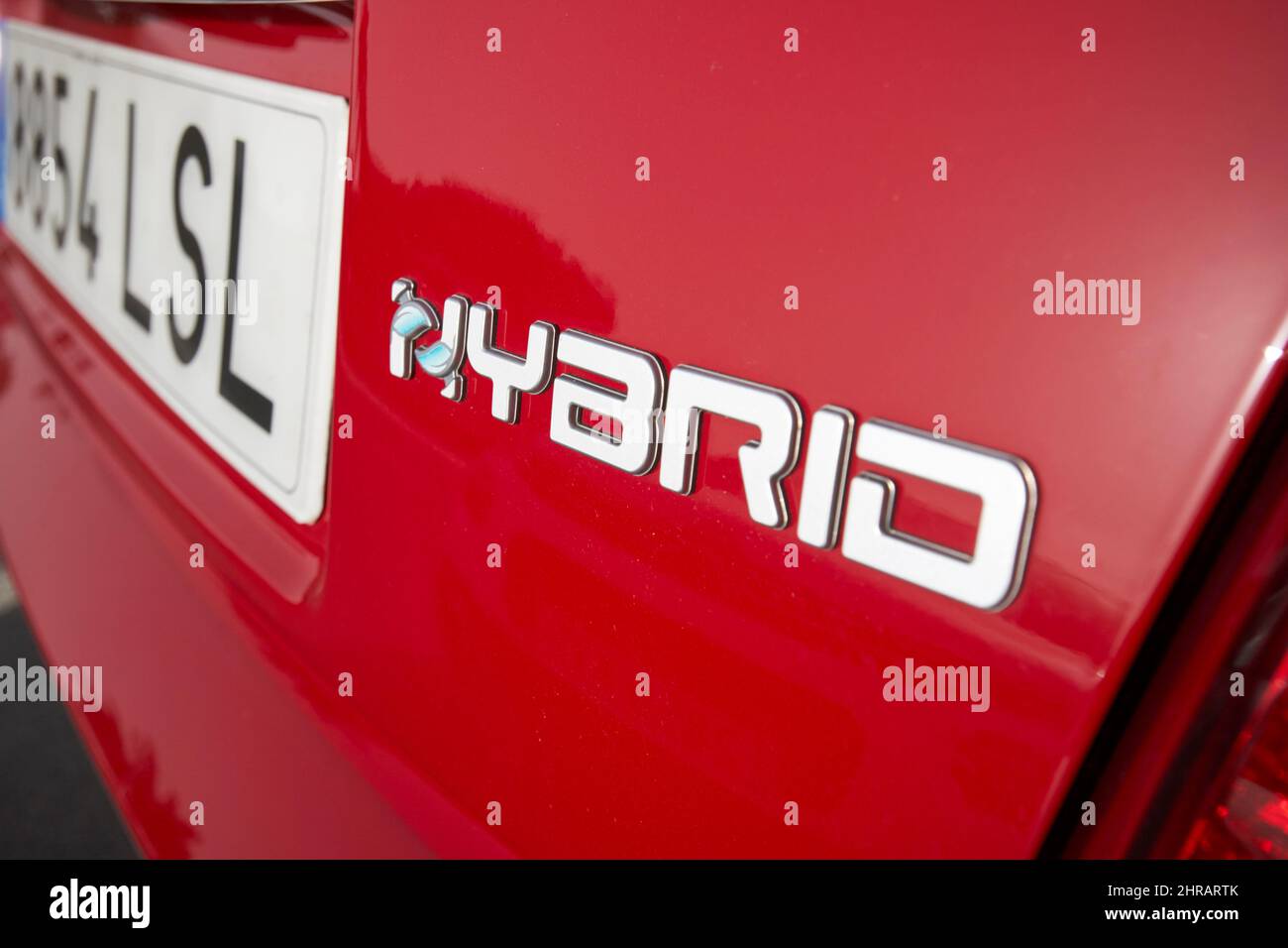 hybrid symbol on a red hire car Lanzarote, Canary Islands, Spain Stock Photo