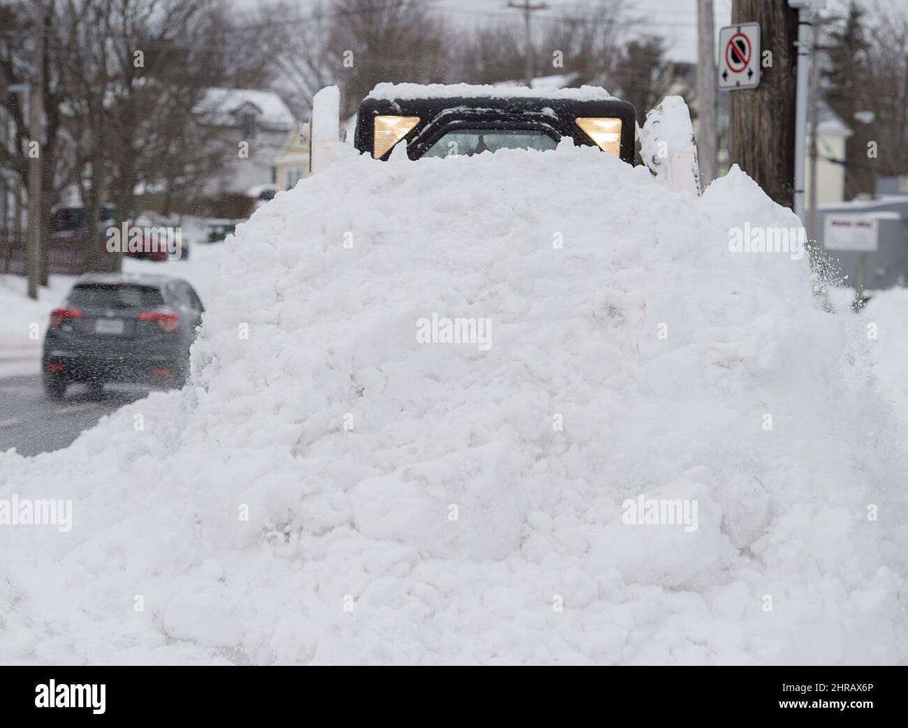 A sidewalk plow moves snow in Halifax on Sunday, Jan. 8, 2017. A
