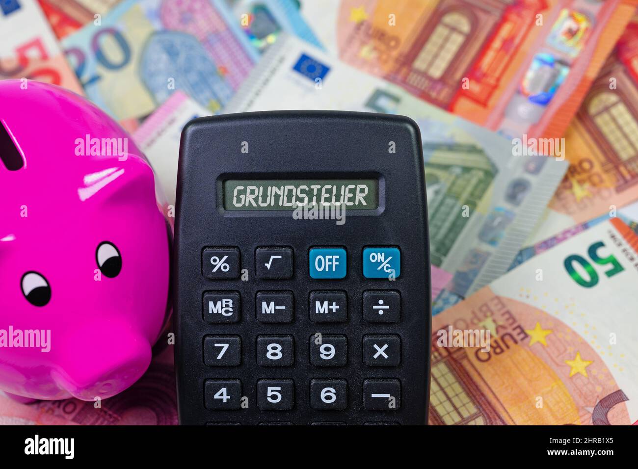 Calculator with the word 'Grundsteuer', translation 'Property Tax' on the display Stock Photo