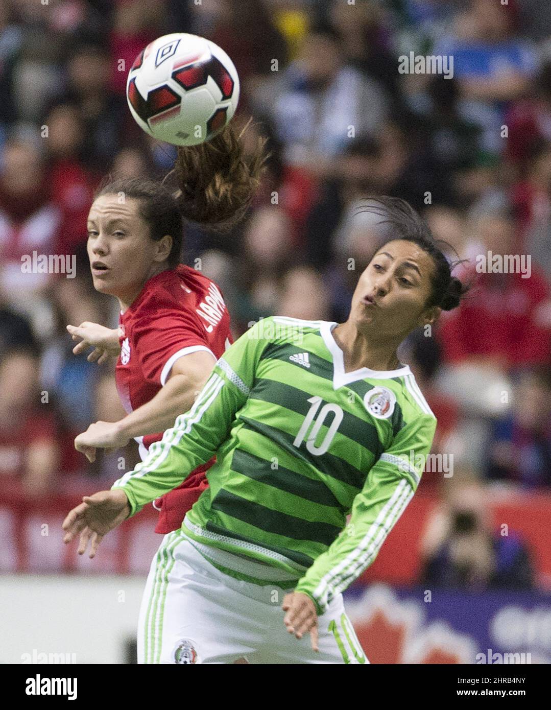 Canada's Allysha Zadorsky fights for control of the ball with Mexico's Stephany Mayor (10) during first half international friendly soccer action at B.C. Place, in Vancouver on Saturday, Feb. 4, 2017. THE CANADIAN PRESS/Jonathan Hayward Stock Photo