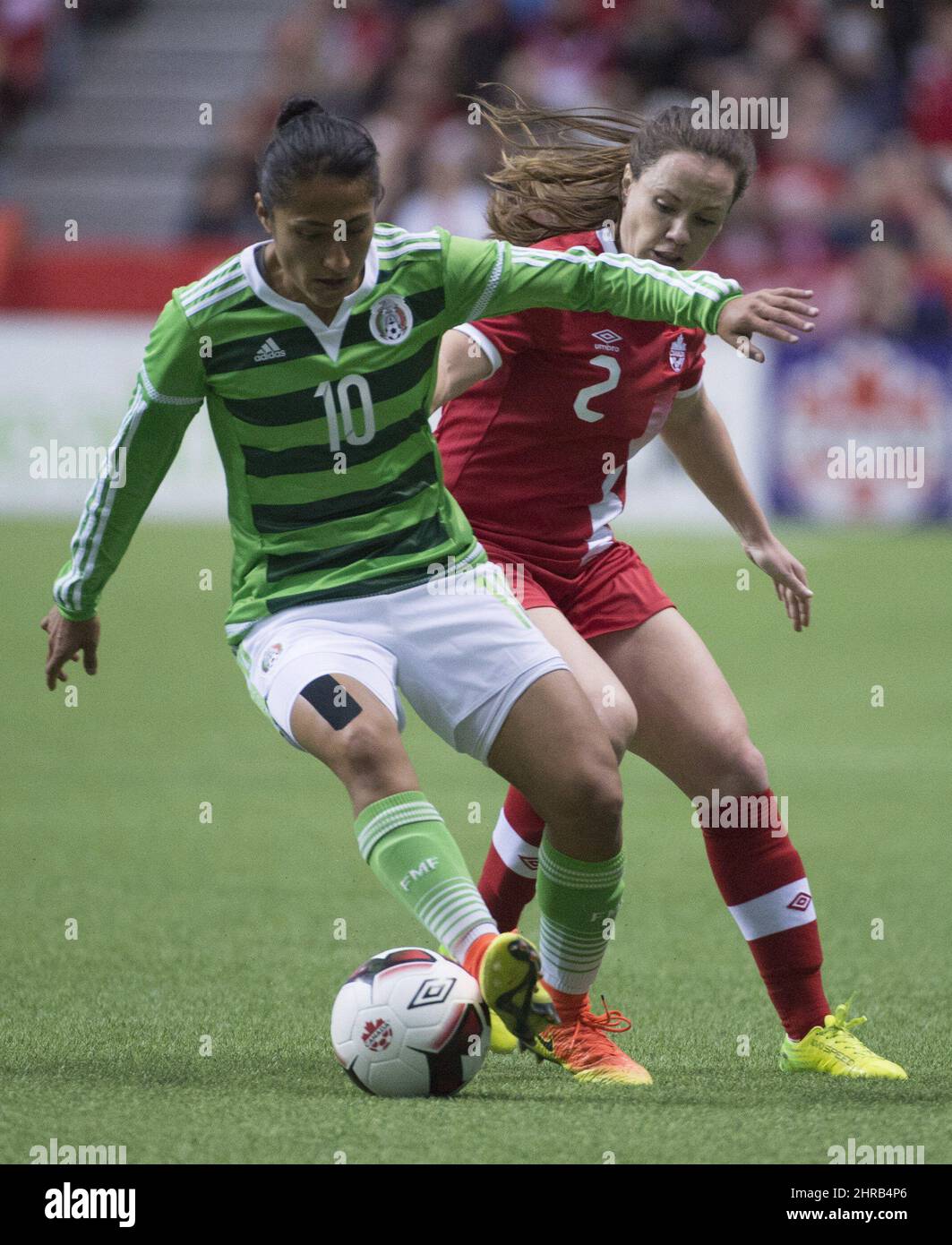 Canada's Allysha Chapman fights for control of the ball with Mexico's Stephany Mayor (10) during first half international friendly soccer action at B.C. Place, in Vancouver on Saturday, Feb. 4, 2017. THE CANADIAN PRESS/Jonathan Hayward Stock Photo