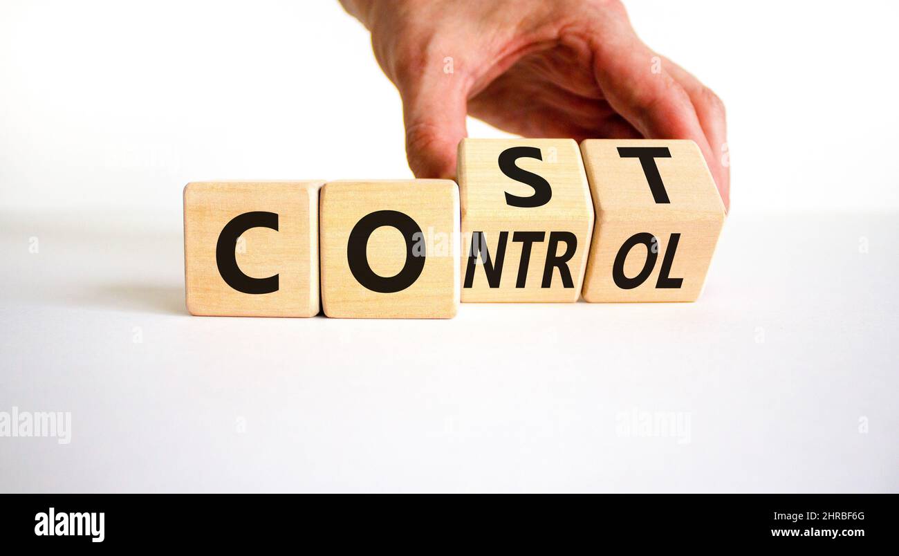 Cost control symbol. Businessman turns wooden cubes and changes the ...