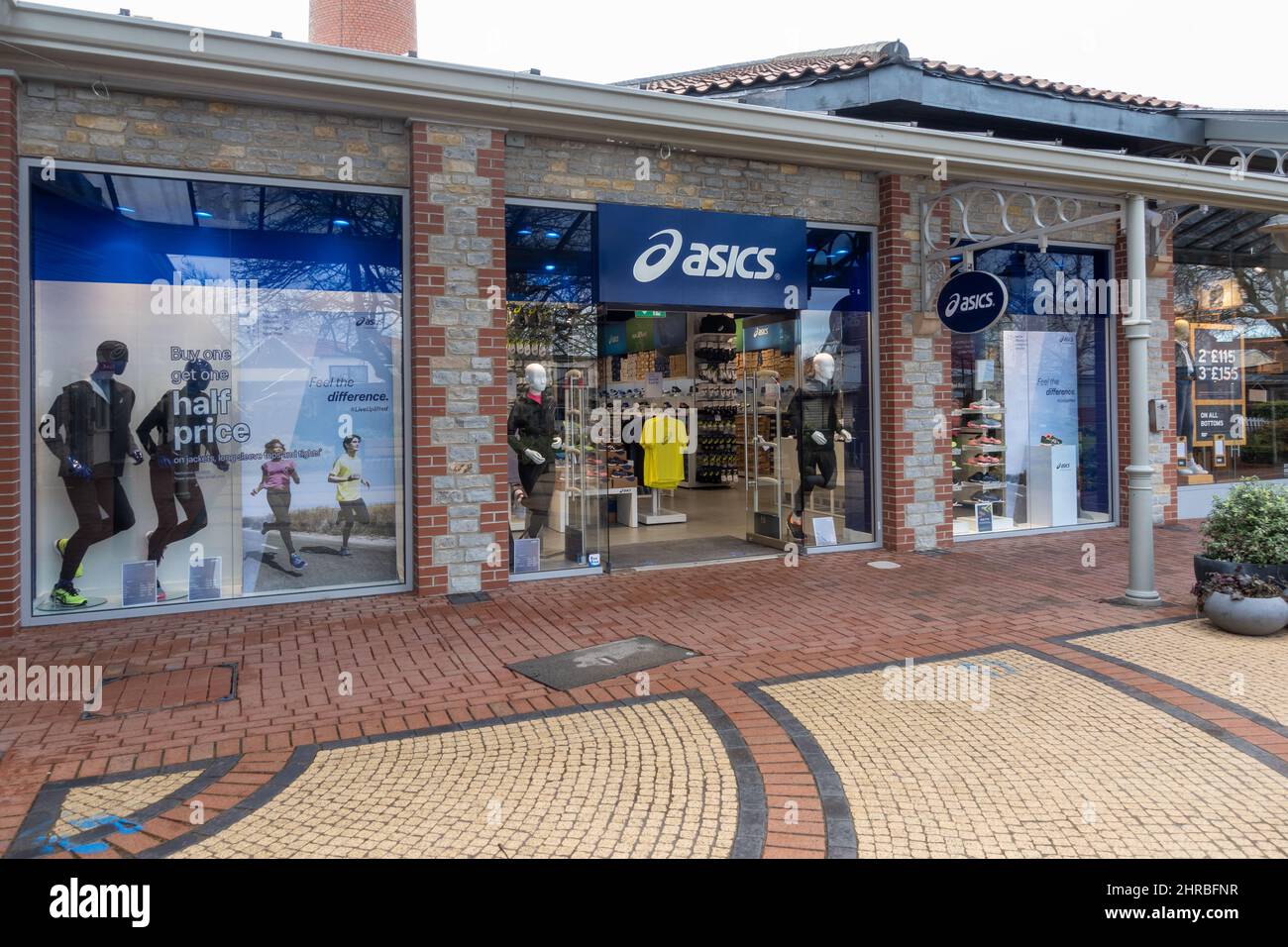 Asics sports equipment store at Clarks Village Outlet Shopping, Street, Somerset, England, UK Stock Photo